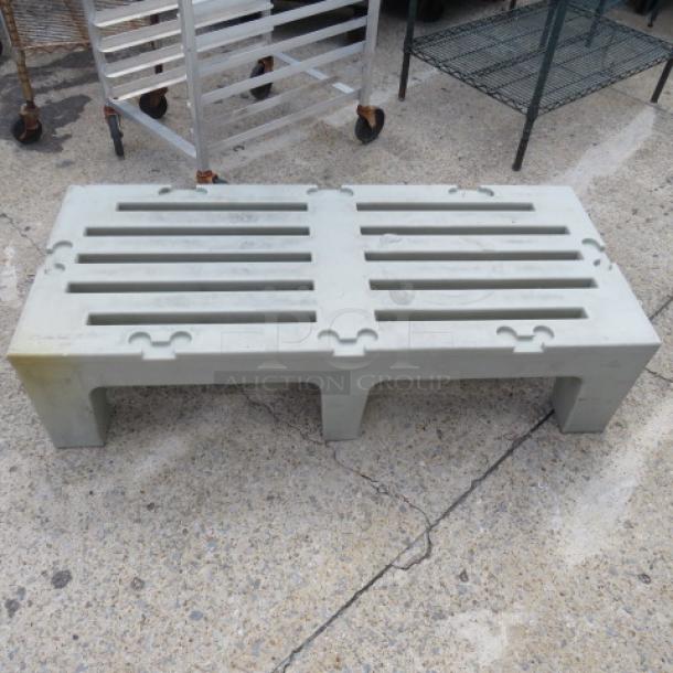 Cambro Poly Dunnage Rack, Model D480, with 3,000lb capacity. Durable, used condition. Pale gray color.