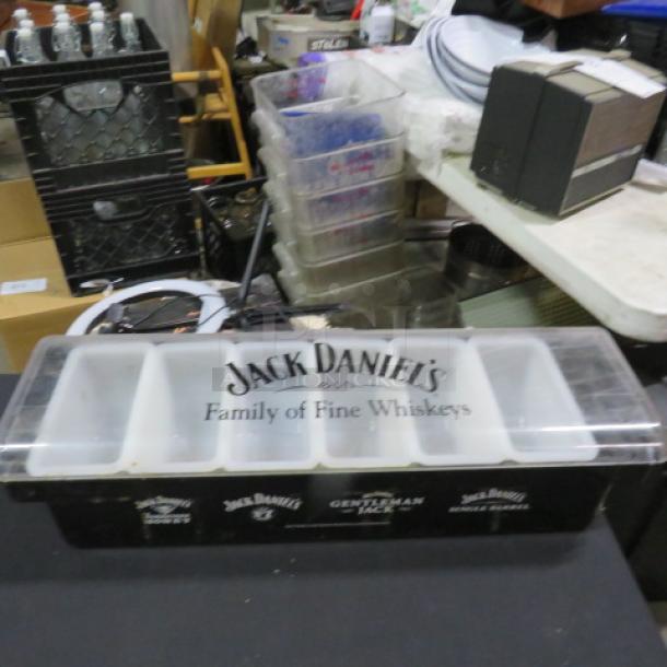 Jack Daniels domed bar center, featuring compartments and "Family of Fine Whiskeys" branding, in used condition.