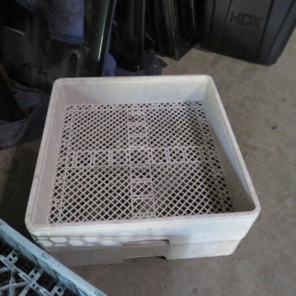 Beige dishwasher rack, model 2XBID, features a grid design for optimal drainage. Good condition, durable plastic material.