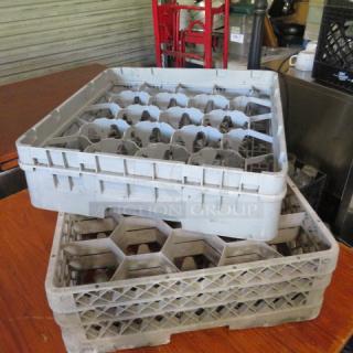 Assorted dishwasher racks, stackable geometric design, used condition, ideal for commercial dishwashers.