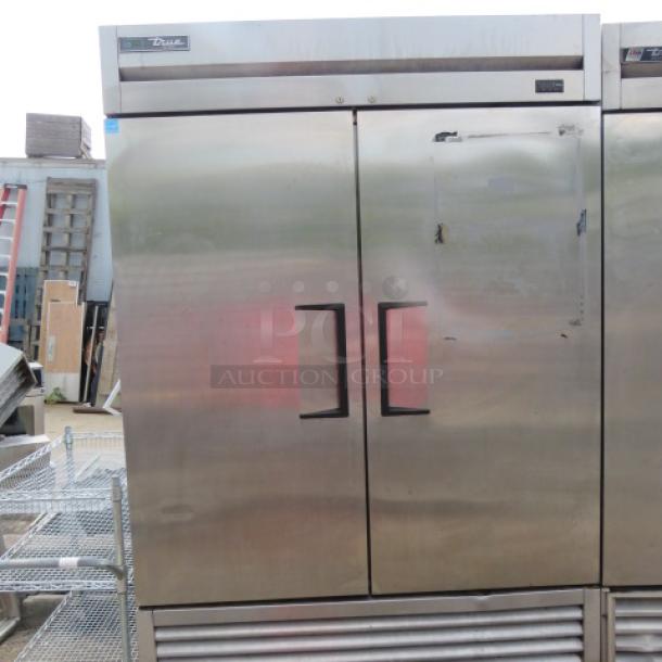 True T-49F-HC 2-door freezer, 54x30x83 inches, on casters, includes 6 racks, stainless steel, 115V, excellent condition.