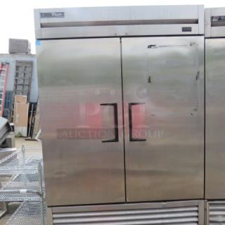 True T-49F-HC 2-door freezer, 54x30x83 inches, on casters, includes 6 racks, stainless steel, 115V, excellent condition.