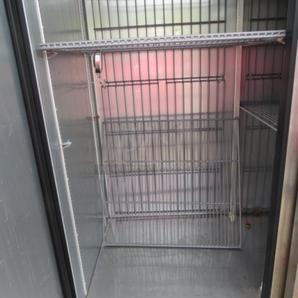Two-door True freezer, model T-49F-HC, with six racks, on casters. Dimensions: 54"x30"x83". 115 Volt.