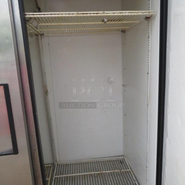 True T-49 2-door refrigerator with four racks, on casters. Measures 54x30x83 inches. Good condition, 115 volt.