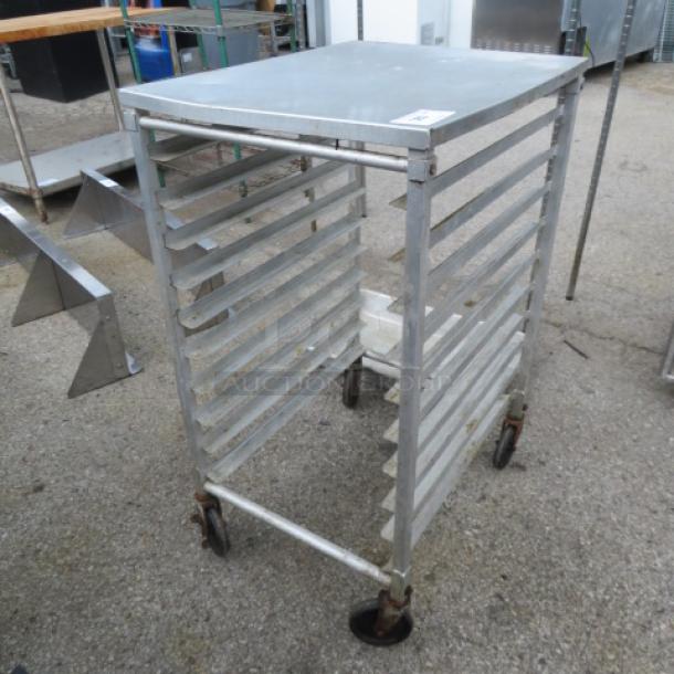 One Speed Rack on casters, 20.5x26x39 inches, metal construction, used condition with visible wear.