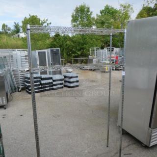 Metro shelf unit, 48x14x75 inches, with 2 adjustable wire shelves. Used condition. Ideal for storage solutions.