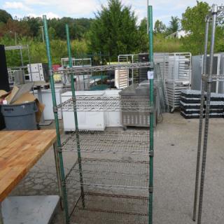 Metal Metro shelf unit with 5 wire shelves, measuring 30x18x75 inches. Used condition with visible wear. No markings visible.