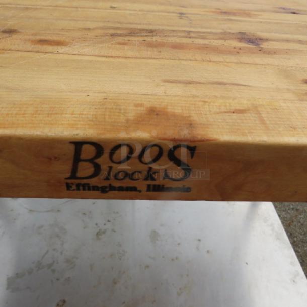 Boos Block butcher block table with a 1-3/4" thick wood top, split design, stainless steel under-shelf, 48"x30"x34", branded edge.