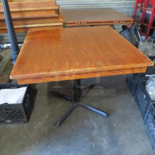 Solid wood table with pedestal base, 36x36x29 inches. Square top, natural finish, good condition, ideal for dining.