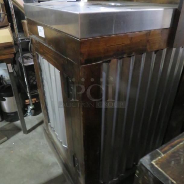 Wooden metal trash receptacle with stainless steel top and trash can, featuring corrugated metal sides, in good condition.