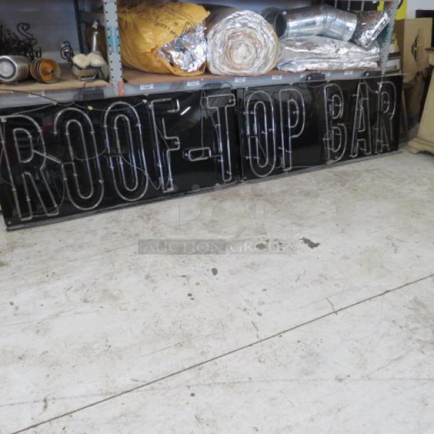 Two-piece "ROOFTOP BAR" neon sign, black background, dimensions 148x30.5, good condition, visible wiring on shelving.