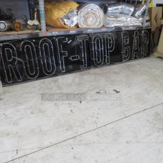 Two-piece "ROOFTOP BAR" neon sign, black background, dimensions 148x30.5, good condition, visible wiring on shelving.
