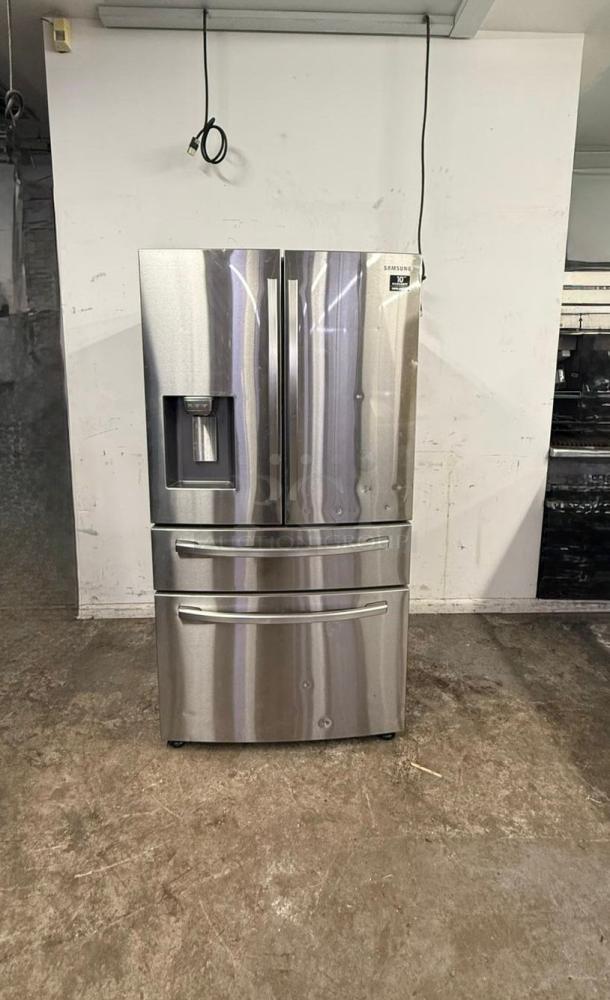 Samsung 4-Door French Door Smart Refrigerator, stainless steel, with FlexZone Drawer and water dispenser, excellent condition.