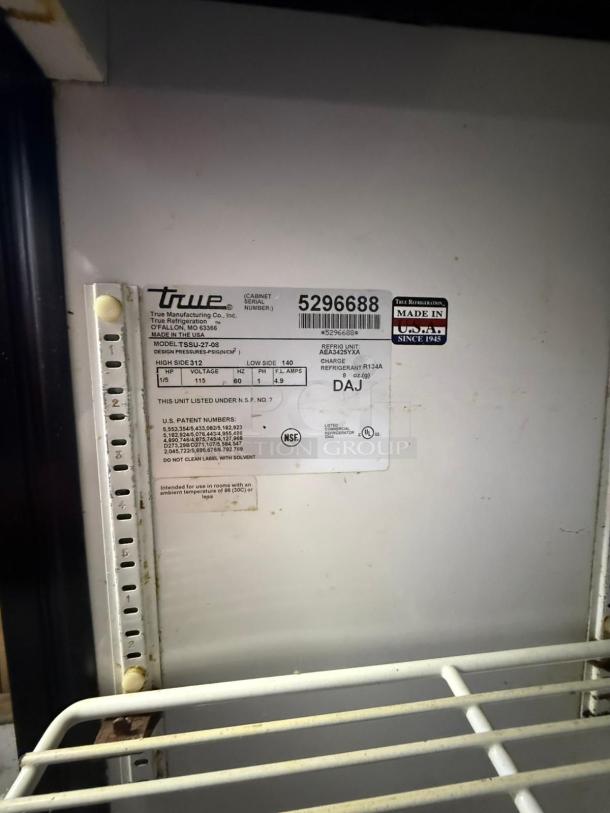 Delfield 4448NP-18M refrigerated sandwich prep table, 48", 2 doors. Interior label showing model and specifications.