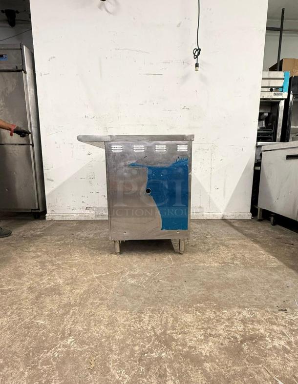 Stainless steel undercounter steam table, excellent condition, partial blue protective film, sturdy legs, seamless finish.