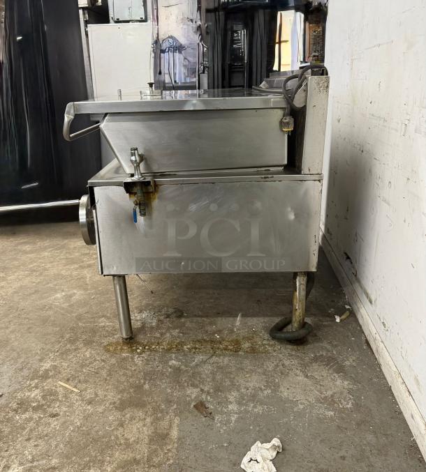 40 Gallon CLEVELAND Tilt Skillet in used condition, stainless steel, side view, visible tap and power cord, on metal legs.