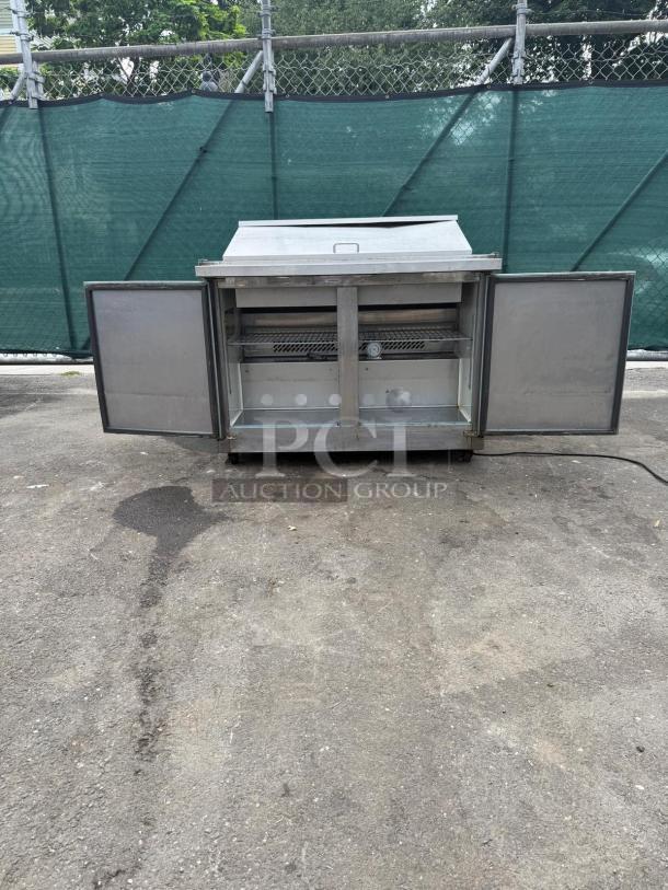 Kelvinator Commercial KCHMT48.18 48" Mega Top Sandwich/Salad Prep Table, refrigerated base, stainless steel, open doors.