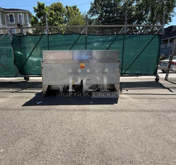 Delfield Model 4472M-30M-A1 72in stainless steel 3-door mega top refrigerated sandwich prep unit. Outdoor image, used condition.