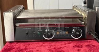 Hot Dog Roller Grill XCJ-9CZ-US, slanted top, manual controls, 120v, used condition, dual temperature knobs, metal exterior.