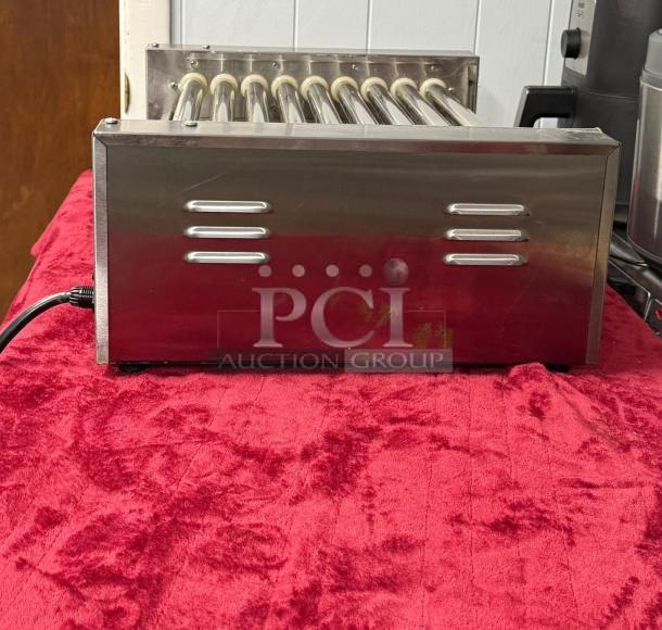 Hot Dog Roller Grill XCJ-9CZ-US with manual controls, slanted top, 120v, stainless steel, used condition.