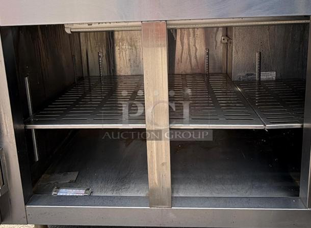 HEATCRAFT Refrigerator Unit RAMK23AG, stainless steel, two shelves, visible interior, auction markings, good condition.