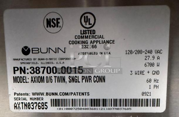 Bunn 38700.0015 Axiom 0/6 Twin Coffee Brewer label showing model, serial number AXTN037685, and electrical specifications.