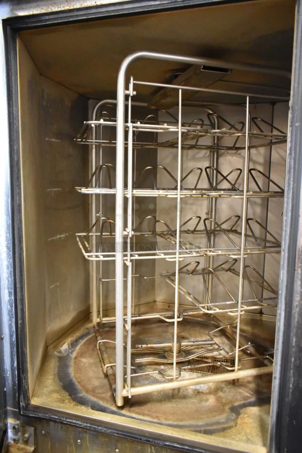 Baxter BV400G stainless steel commercial rack oven, natural gas, self-cleaning, with pan rack on casters, interior view.