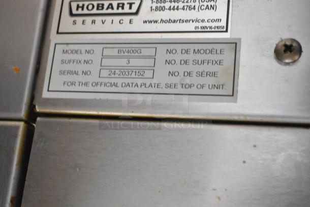 Baxter BV400G stainless steel commercial oven tag, showing model, suffix, and serial numbers, with Hobart service contact.
