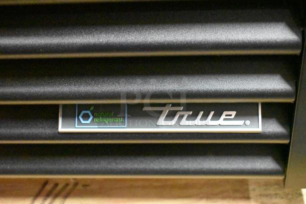 True GDM-23-HC cooler logo and emblem, indicating natural refrigerant. Brand new with potential scratch and dent.