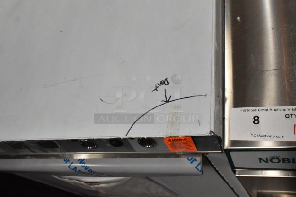 Brand new Champion UH230B stainless steel commercial dishwasher, visible scratch and dent, model label, caution sticker.