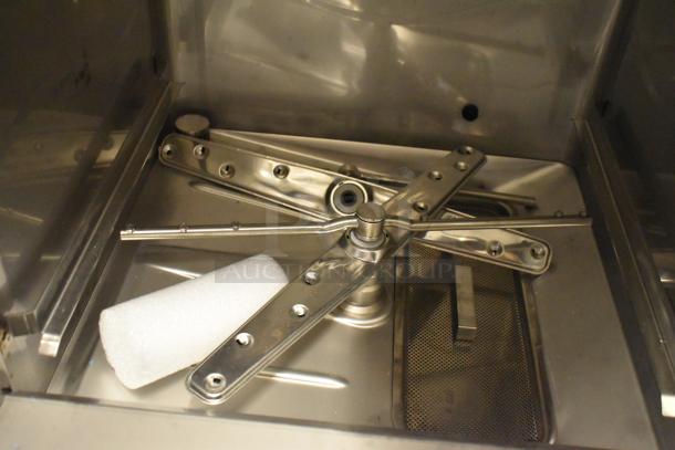 Brand new scratch and dent 2025 Champion UH230B stainless steel undercounter dishwasher; visible internal components.