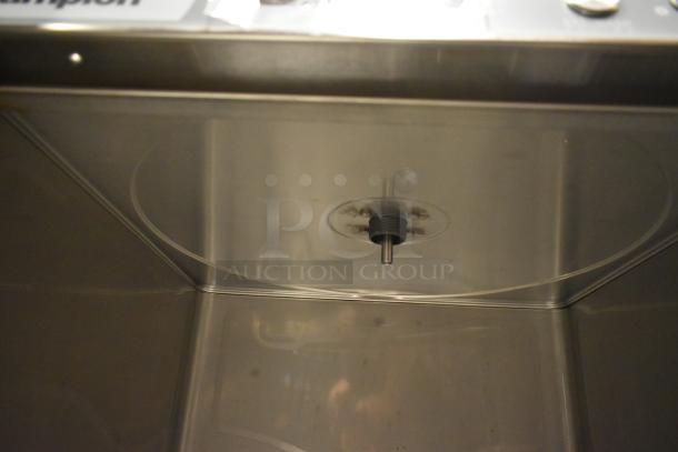 Brand new Champion UH230B stainless steel undercounter dishwasher interior, showing high-temp components. Scratch and dent condition.