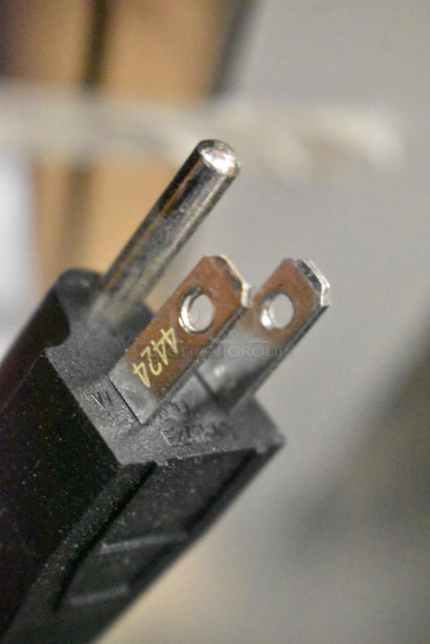 Close-up of a power plug for the Waring WSM20LT 20 Quart Planetary Mixer. 110-120 Volts, 1 Phase. Marking reads "424".