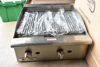 BRAND NEW Cecilware Pro CCP24 stainless steel charbroiler grill, natural gas, with protective wrap, dual knobs, and warning label.