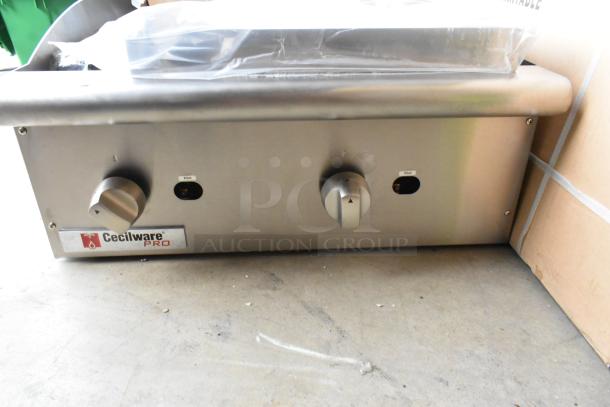 BRAND NEW Cecilware Pro CCP24 stainless steel countertop charbroiler grill, natural gas, model label visible.