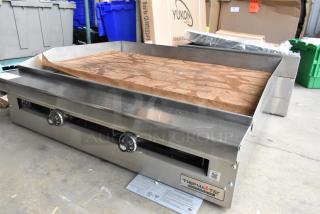 Brand new 2021 Therma-Tek TC36-36TGL stainless steel commercial propane flat top griddle with dual control knobs.