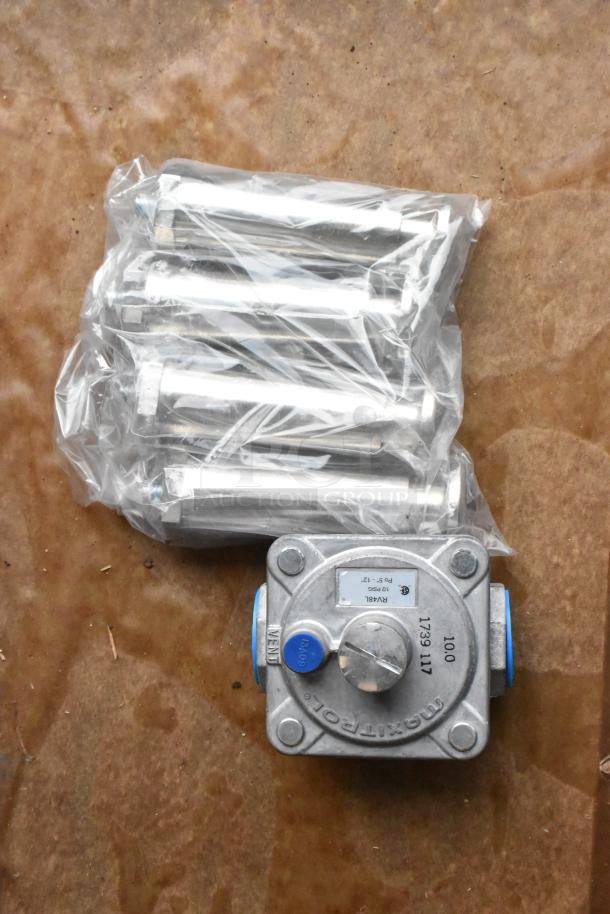 Bag of metal bolts with protective wrap and a gas regulator valve, not the Therma-Tek griddle specified.