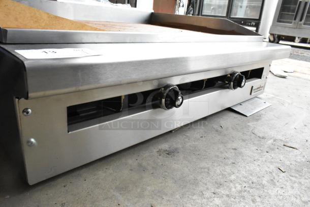 Brand new 2021 Therma-Tek TC36-36TGL stainless steel countertop propane flat top griddle. Visible control knobs and label.