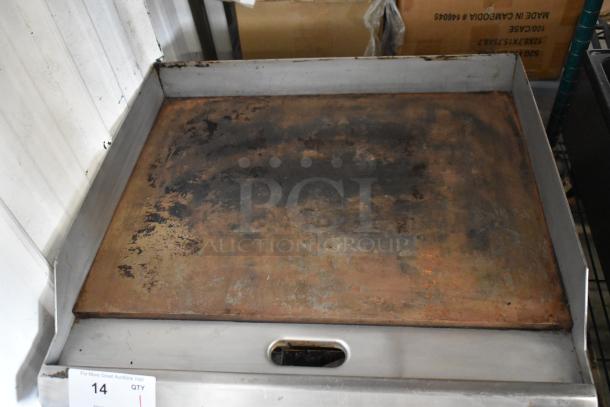 Stainless steel commercial countertop gas griddle; flat top, used condition with visible wear; size suitable for professional use.