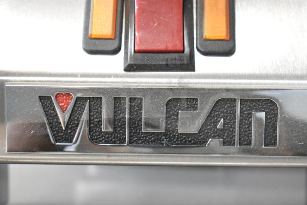Vulcan stainless steel hood for a flat top griddle, model VMCS-101BFIFM, with visible branding and control buttons.