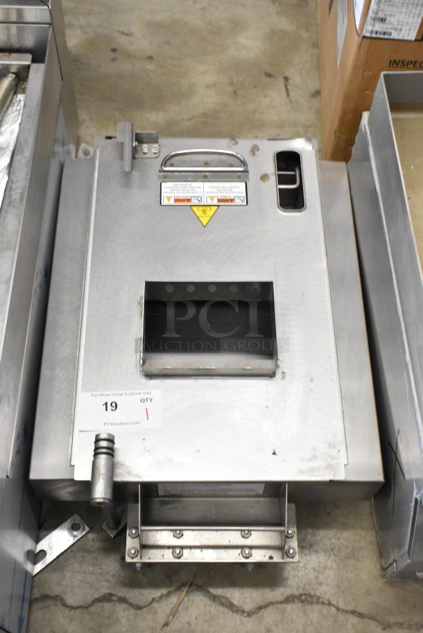 Metal commercial grease trap, featuring sturdy construction with commercial casters, visible safety warnings, and entry port.