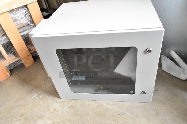 Telege TGZAUA6-A1L1AGN white metal cabinet with keys, door will not open, visible label detailing model information.