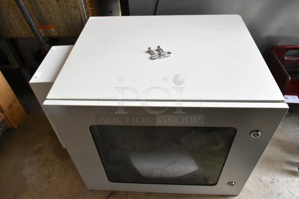Telege TGZAUA6-A1L1AGN white metal cabinet with visible keys on top. Door will not open. Appears in good condition.