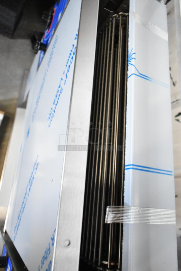 Brand new Prince Castle 296-T55JACK stainless steel vertical contact toaster, 115V, 1 phase, in protective packaging.
