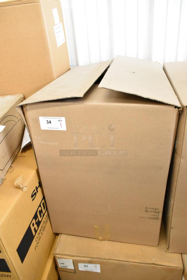 Brand new APW Wyott M-95-2 stainless steel bun toaster in sealed box. 865 slices/hr, 240V, 1 phase. Tag reads "34 QTY 1".