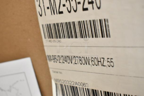 Brand new APW Wyott M-95-2 stainless steel bun toaster in box, 865 slices/hr, 240V, model details visible on label.