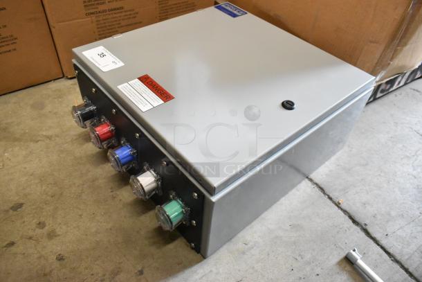 Power Assemblies gray metal box with multicolored connectors and danger label, in good condition, for industrial use.