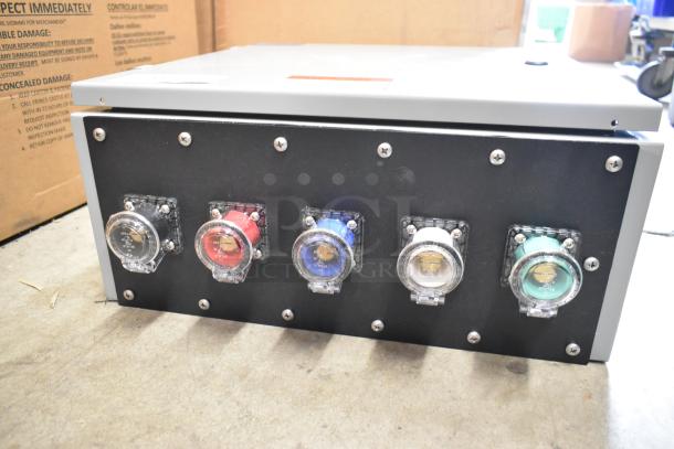 Power Assemblies gray metal box with colored connection ports, new condition, featuring visible industrial design elements.