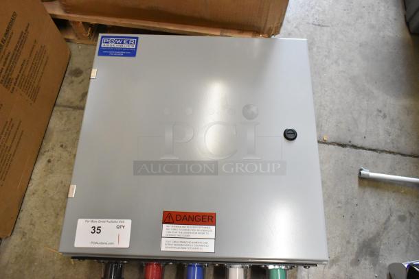 Power Assemblies gray metal box, features branded label, warning sticker, and lock. Good condition. Auction item 35.