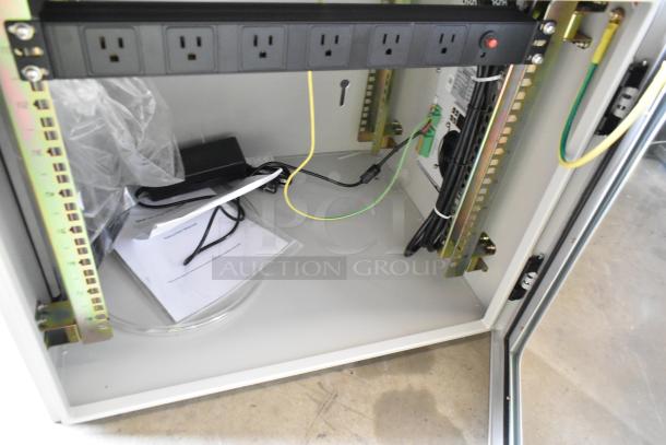 BRAND NEW BlackShields DC0300 white metal cabinet with power strip, wiring, and instruction manual visible inside.